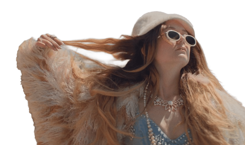 A woman with blonde hair and a white coat. Description generated by AI