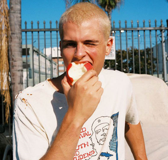 A man eating an apple. Description generated by AI