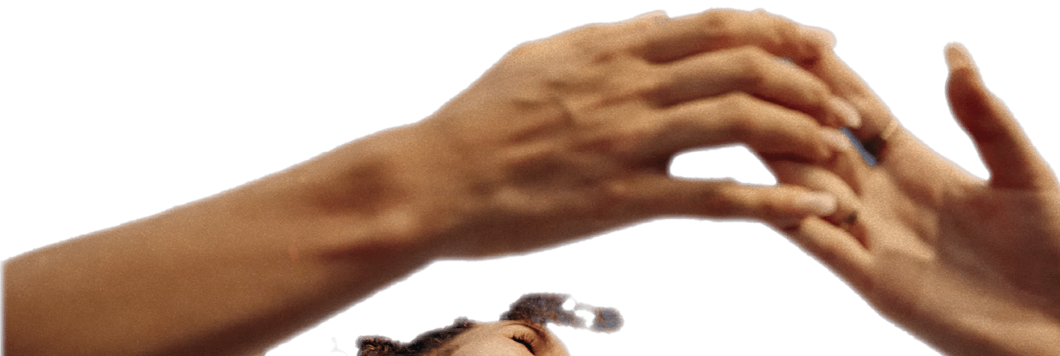 Two women with their hands up in the air. Description generated by AI