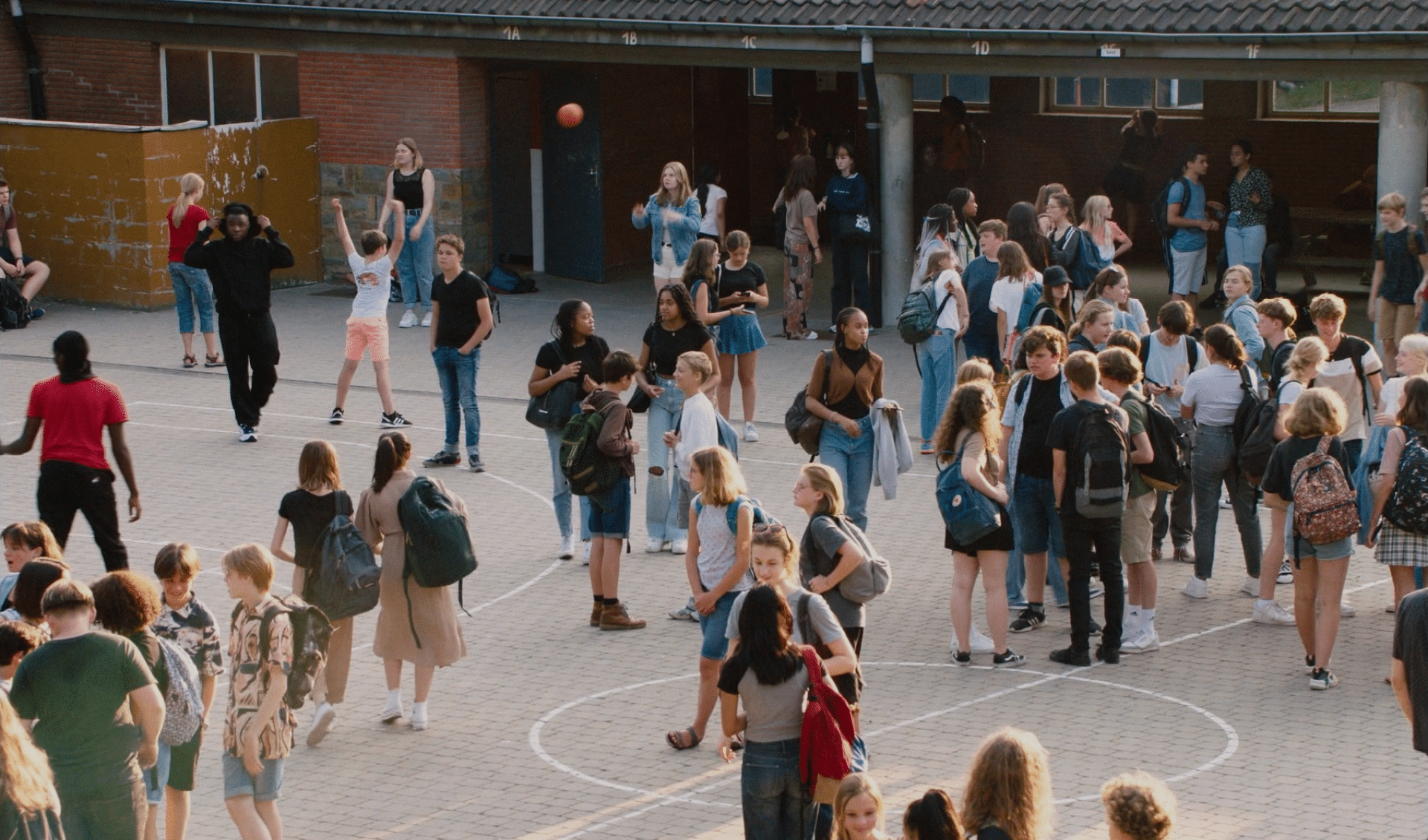 A group of people standing in a circle. Description generated by AI